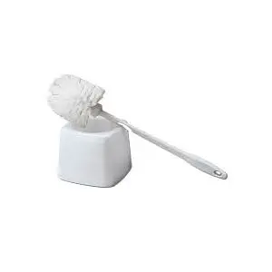 A white cleaning brush on top of a white container.